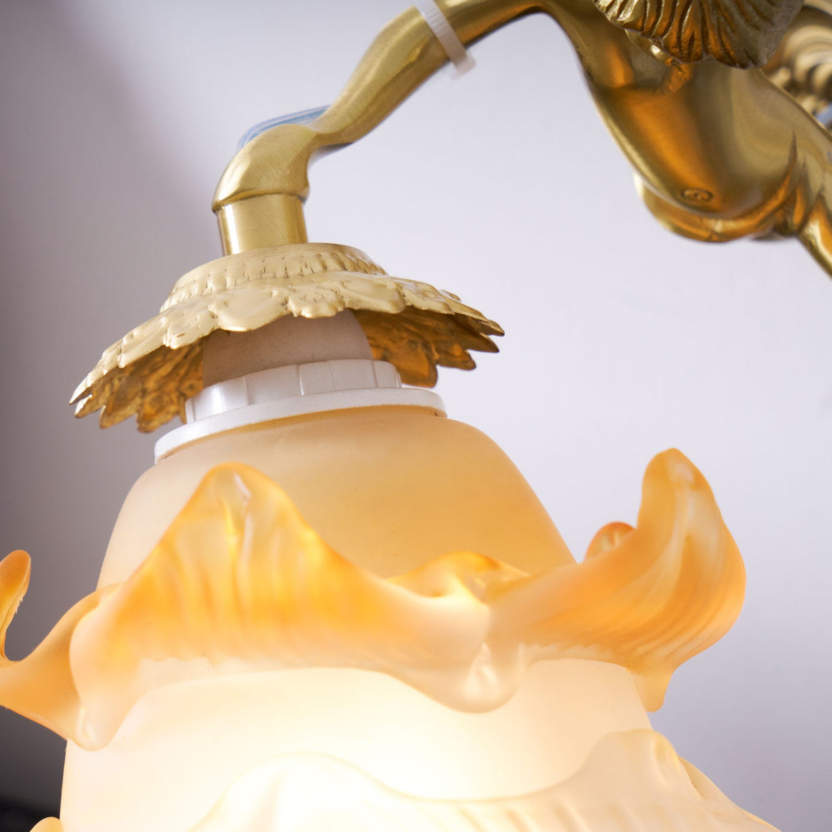 antique-brass-wall-sconce-with-angel-figurine-detail-img16.jpg